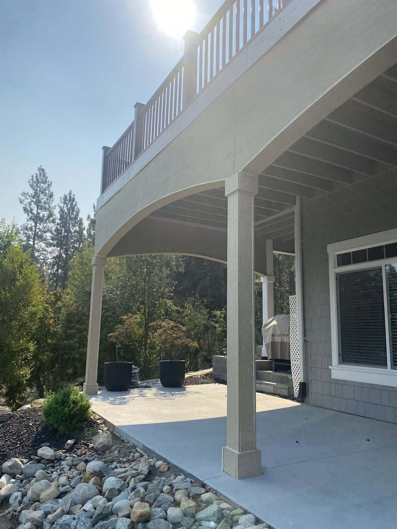 Covered patio space finished under an upper deck